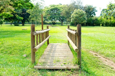 tropical wood bridge on green grass background   の写真素材
