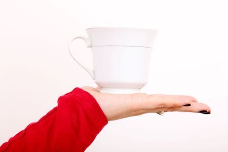 Woman hand with cup over white backgroundの写真素材