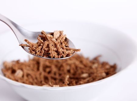 Brown fiber cereal. Spoon and dish objectsの写真素材