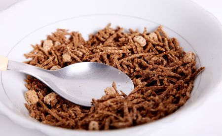 Brown fiber cereal. Spoon and dish objectsの写真素材