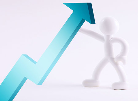 White icon holding blue arrow over white backgroundの写真素材