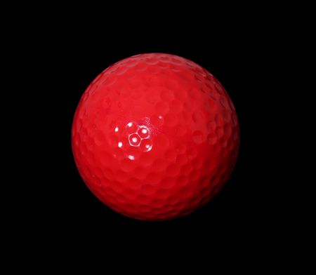 Red gold ball over black background. Isolated imageの写真素材