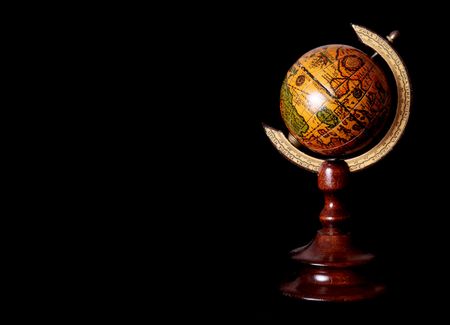 Old world over black background. Space to insert text or designの写真素材