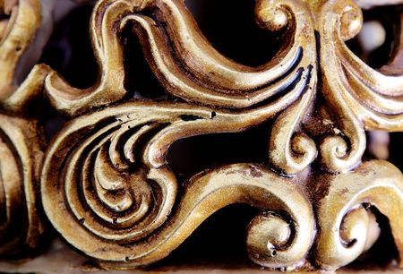 Gold abstract shape over black background. Closeupの写真素材