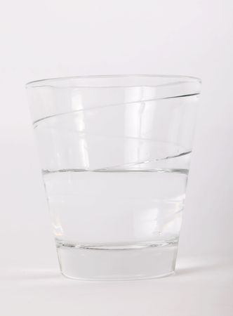 Glass with water over white background. Drink imageの写真素材