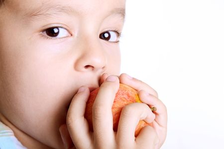 Five year old boy eating apple.  Healthy Eatingの写真素材
