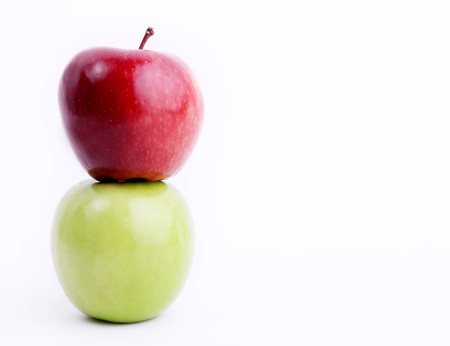 Red and green apple on white background. Space to insert text or design. Concepts: Food, Nutrition & Wellnessの写真素材