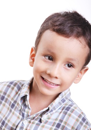 Smiling little boy on a white backgroundの写真素材