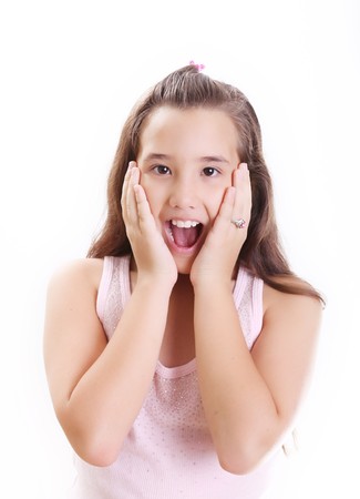 Girl expressing surprise over white background. Isolated imageの写真素材