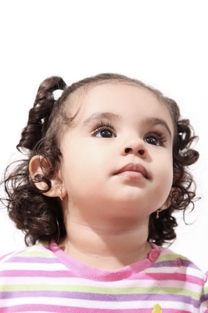 Two years girl looking up over white background. Portraitの写真素材