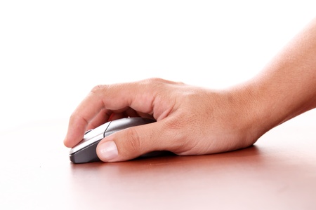 Hand of a man using a wireless computer mouseの写真素材