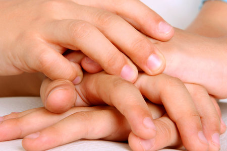 Hands of children together as a symbol of friendship, brotherhood and teamwork