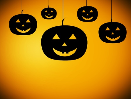 five black pumpkins over orange background. halloween illustrationの写真素材