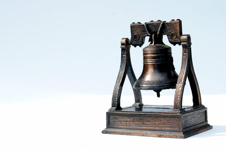 antique bell on white background, bronze textureの写真素材