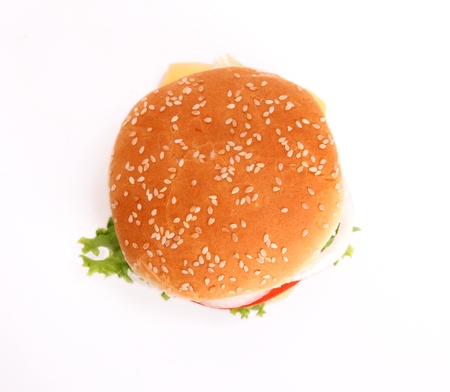 hamburger with bread,tomato,onion,lettuce,meat,cheese,ham, isolated over white background の写真素材