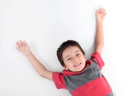 child with outstretched arms on a white backgroundの写真素材