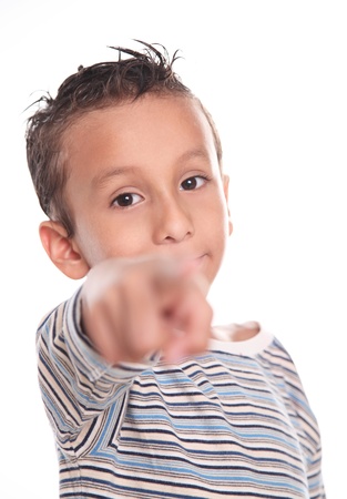 Child looking and pointing the camera, on white backgroundの写真素材