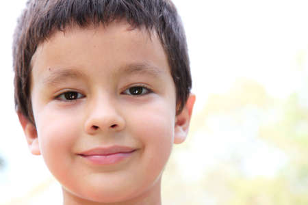 7 years old boy smiling,  outdoor imageの写真素材