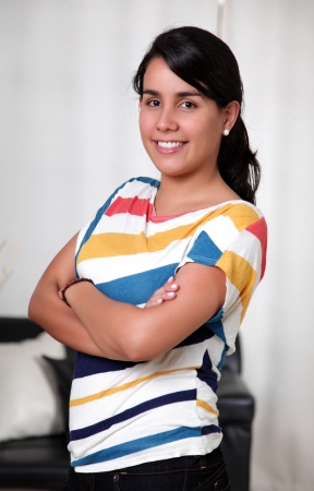 Smiling woman with hands folded and happyの写真素材