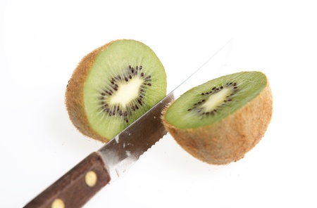 isolada Kiwi with a knife over white backgroundの写真素材