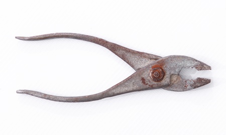 Old vintage steel pincer pliers against the white backgroundの写真素材