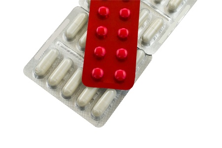 White and Red packing pills on white backgroundの写真素材