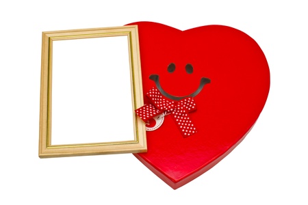 Box in the form of a heart and a frame for photosの写真素材