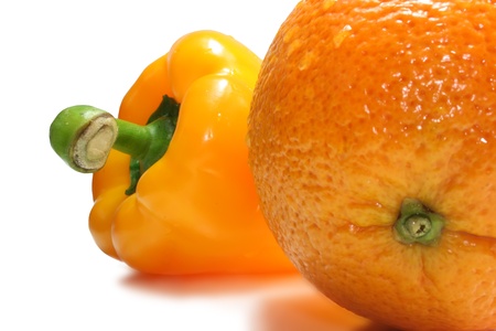 Isolation on a white background an orange and pepperの写真素材