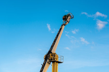 Attraction - a vertical carousel with a person inside, the person's face is blurryの写真素材