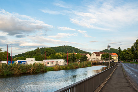 Idyllic Countryside View with River, Road, and Hills near Eschwege, Germanyの写真素材