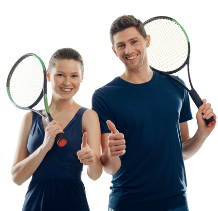 Tennis players showing thumbs up and cheerful smiles. Positive mood and enjoyment of a match. Sport and leisure.の写真素材