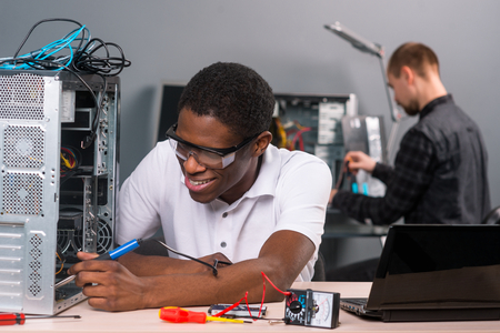 Man soldering electronicsの写真素材