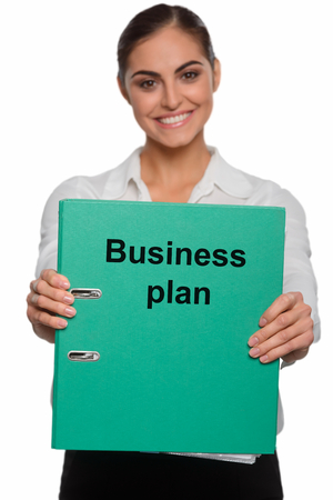 Happy businesswoman with a brilliant planの写真素材