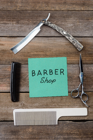 Barbershop sign on wooden backgroundの写真素材