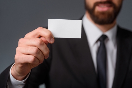Visit card in male handの写真素材