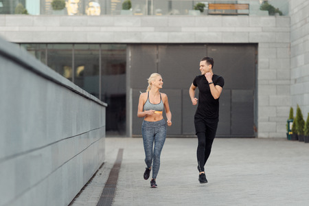 Smiling couple is jogging