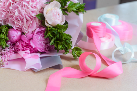 Light pink bouquet and ribbonsの写真素材