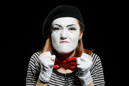 Angry female mime on blackの写真素材