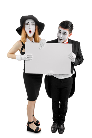 Couple of mimes holding placardの写真素材