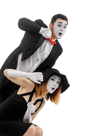 Mimes hiding behind imaginary wallの写真素材