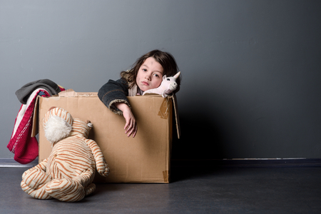 Sad girl and second-hand toysの写真素材