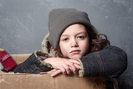 Kid wearing old knitted hatの写真素材