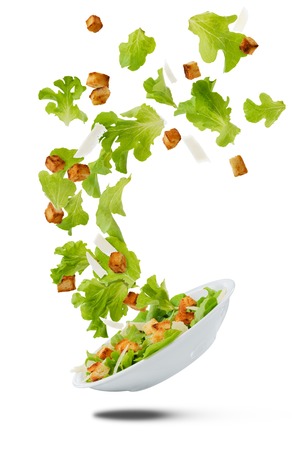Lite salad flying on whiteの写真素材