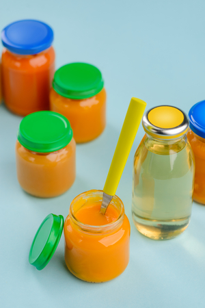 Jars of puree and spoonの写真素材