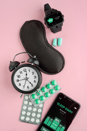 Clock, watch, mask and phoneの写真素材