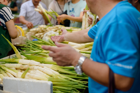 Stem vegetables at a marketの写真素材