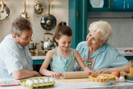Child shows her cooking skillsの写真素材