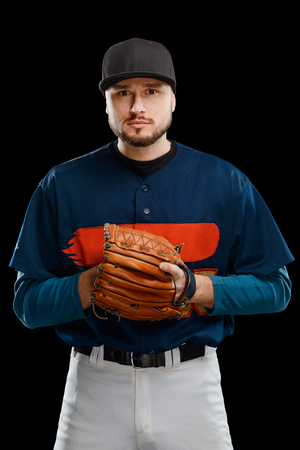 Baseball pitcher on black background