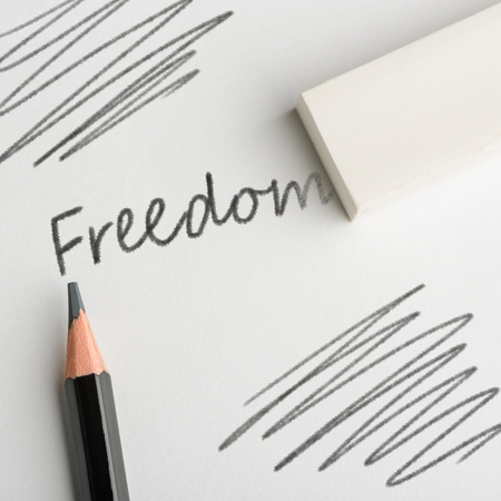 Eraser removing word "Freedom"の写真素材