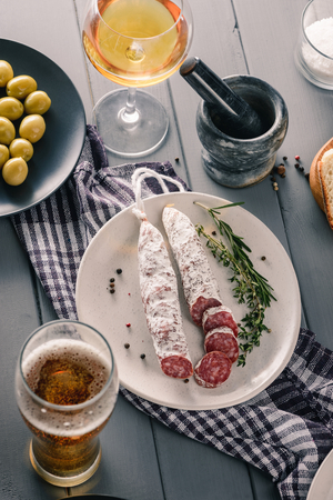 Sliced winter salami, herbs, spiceの写真素材
